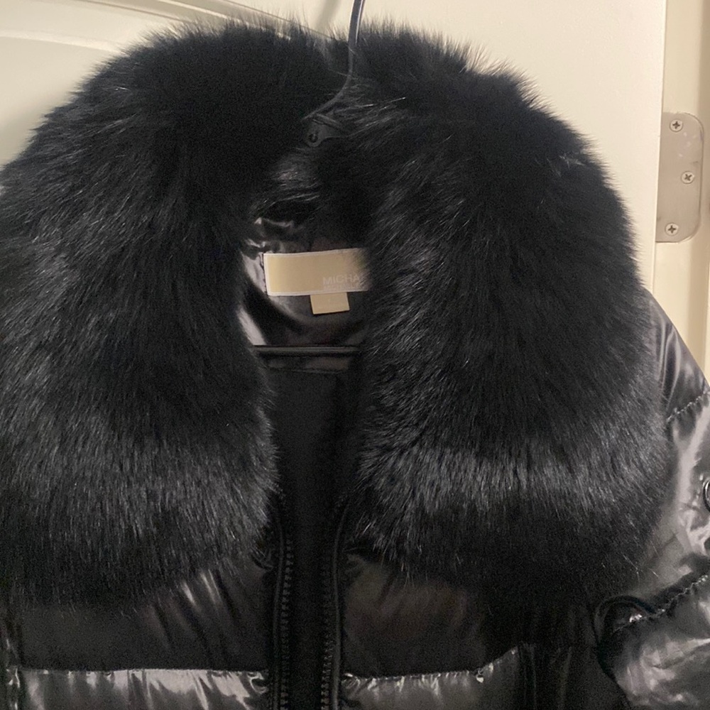 Brand new black Michael Kor bomber coat with fur. Rarely worn.